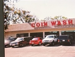 World O' Suds Coin Laundry, 430 E Main St Apopka FL — vintage photo of the original Coin Wash storefront exterior with large roofline lettering and cars in the parking lot
