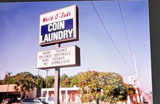 World O' Suds Coin Laundry, 430 E Main St Apopka FL — vintage photo of the road sign reading Many Thanks Orlando Sentinels Mike Thomas We Appreciate