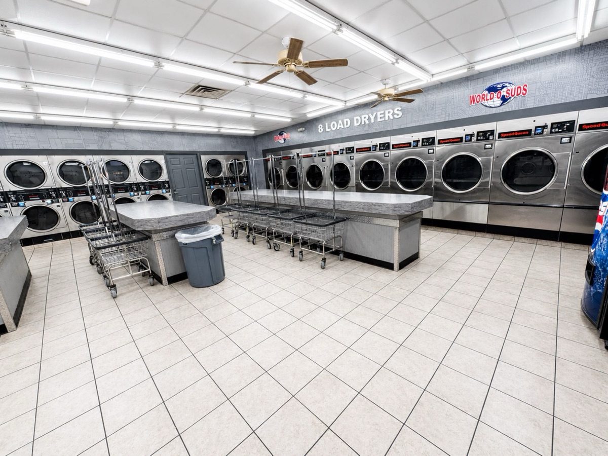 World O' Suds Coin Laundry, 430 E Main St Apopka FL — row of commercial dryers in the laundry facility