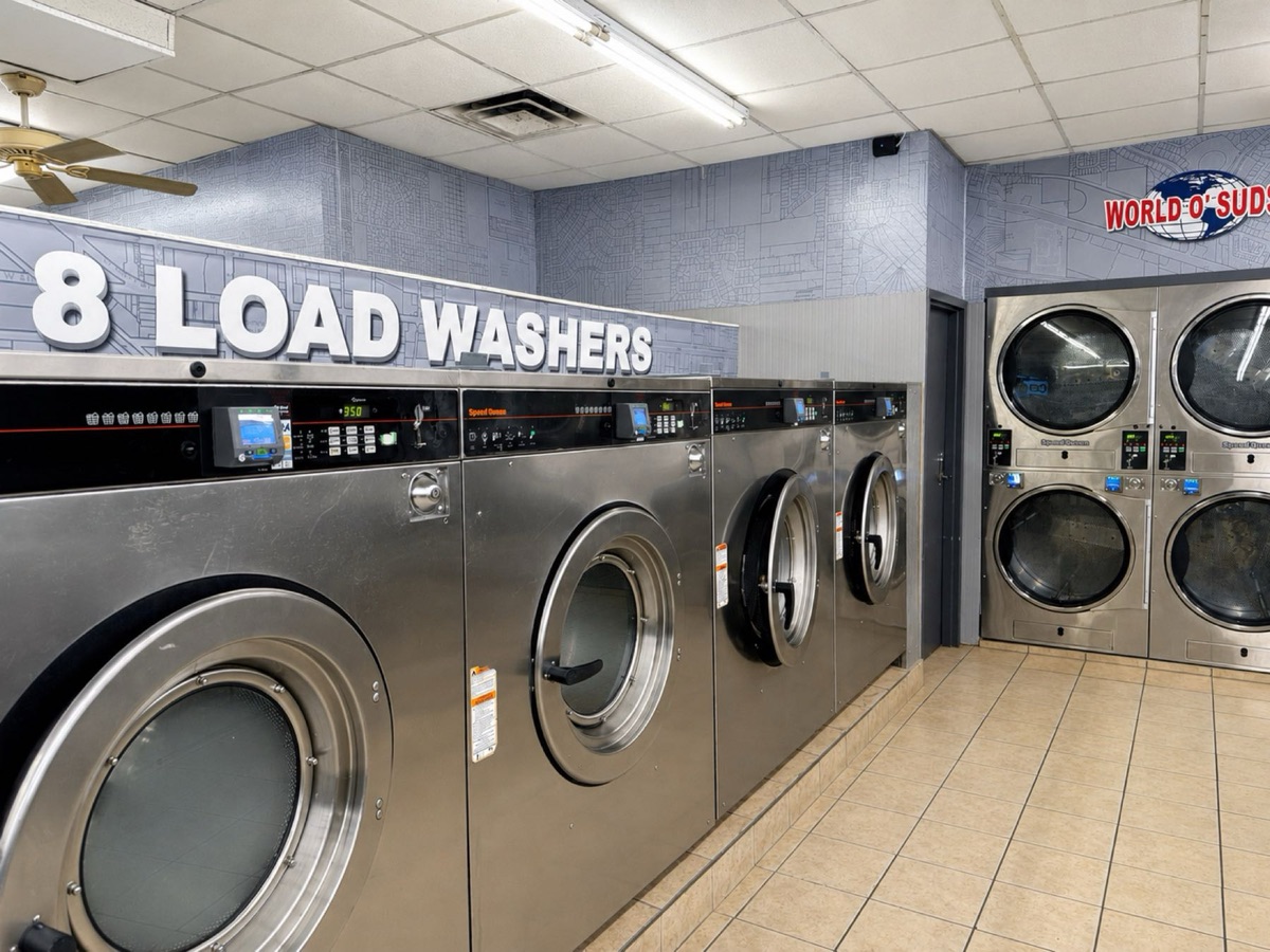 World O' Suds Coin Laundry, 430 E Main St Apopka FL — row of large-capacity washers on the main laundry floor