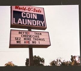 World O' Suds Coin Laundry, 430 E Main St Apopka FL — vintage scan of the original road sign reading BETTER THAN CHEESECAKE WE ARE NO 1